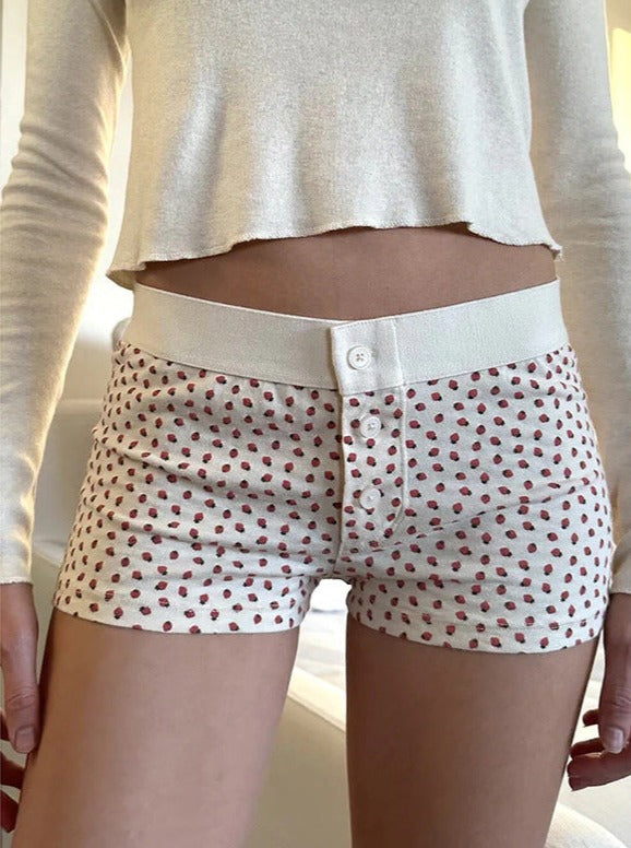 Weiße Shorts mit Knopfleiste und Erdbeer-Print 