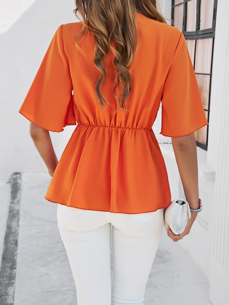 Orangefarbene Bluse mit V-Ausschnitt und Schleife